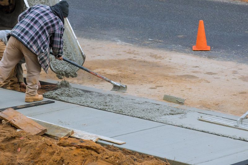 concrete worker levelling wet concrete